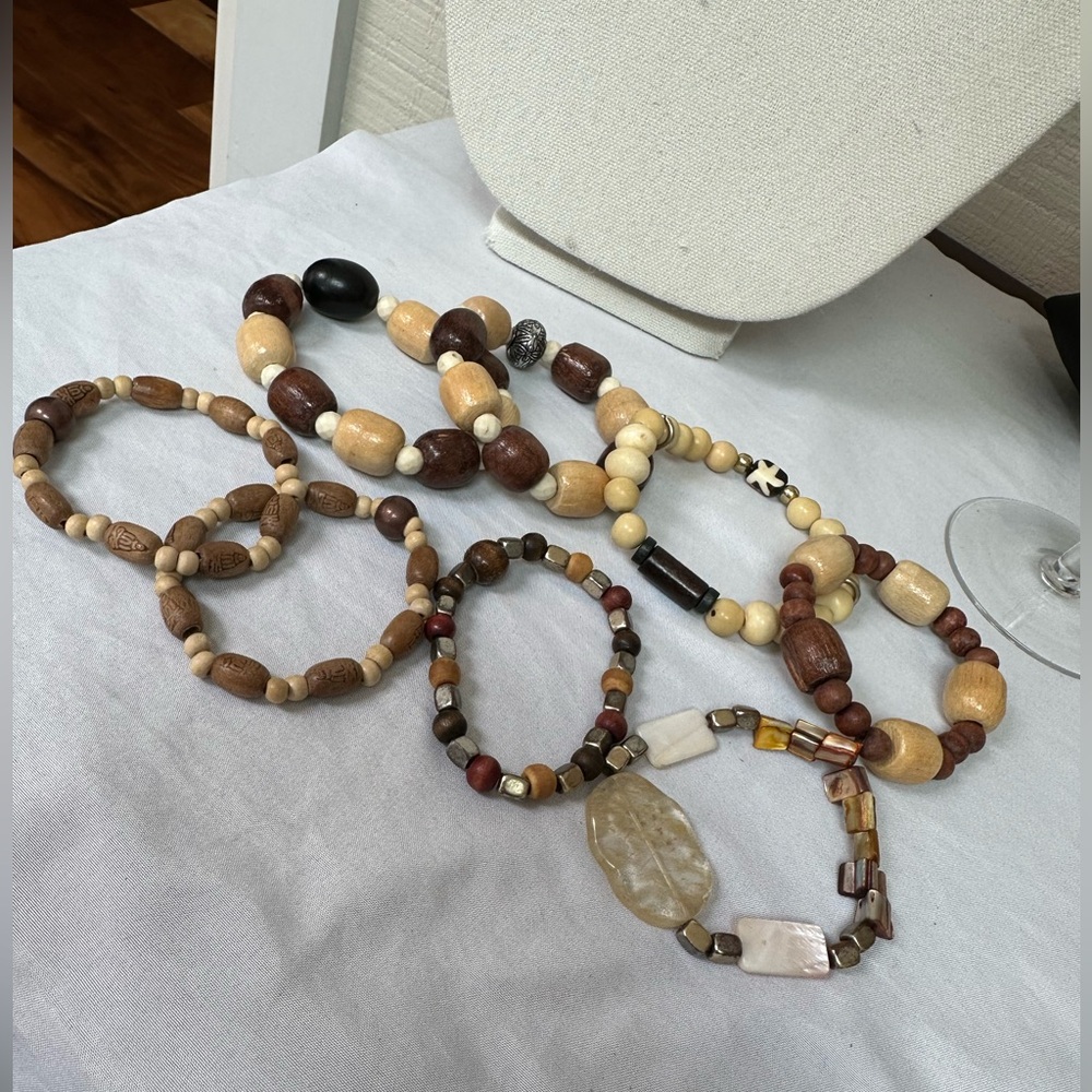 Set of 8 wooden and shell bead stretch style bracelets